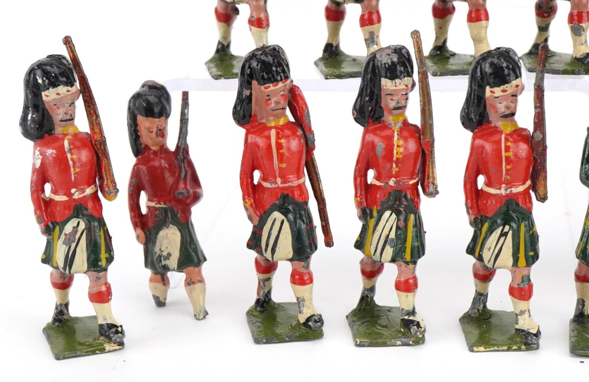 Nineteen Britains hand painted lead Gordon Highlanders soldiers and piper, some with articulated - Image 5 of 8