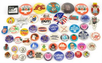 Collection of vintage and later pin badges including I'm Your Flexible Friend, I Boarded HMS