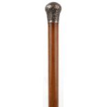 Victorian malacca walking stick with floral engraved silver pommel, indistinctly engraved and