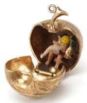 9ct gold engraved apple charm opening to reveal an enamelled study of Adam & Eve and a snake on a