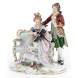 19th century Neapolitan porcelain group in the form of a lady playing a mandolin with tutor