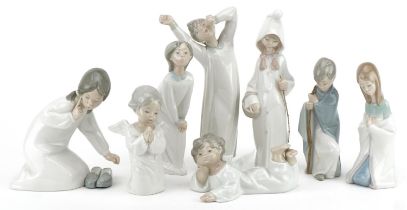 Eight Lladro angels and sleepy children including Morning Boy, the largest 21cm high : For further