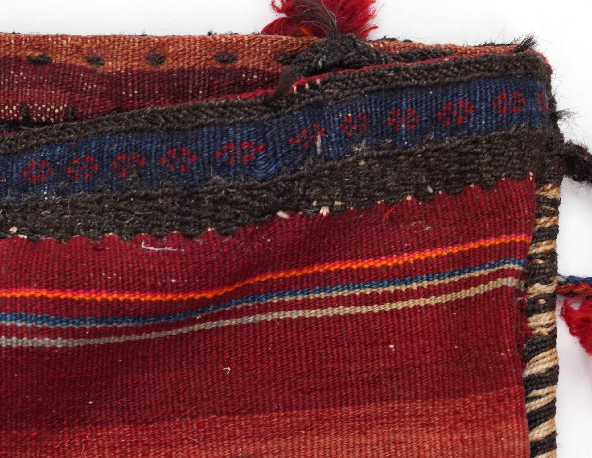 Rectangular Afghan red ground saddle bag having an allover repeat design, 150cm x 80cm : For further - Image 6 of 7