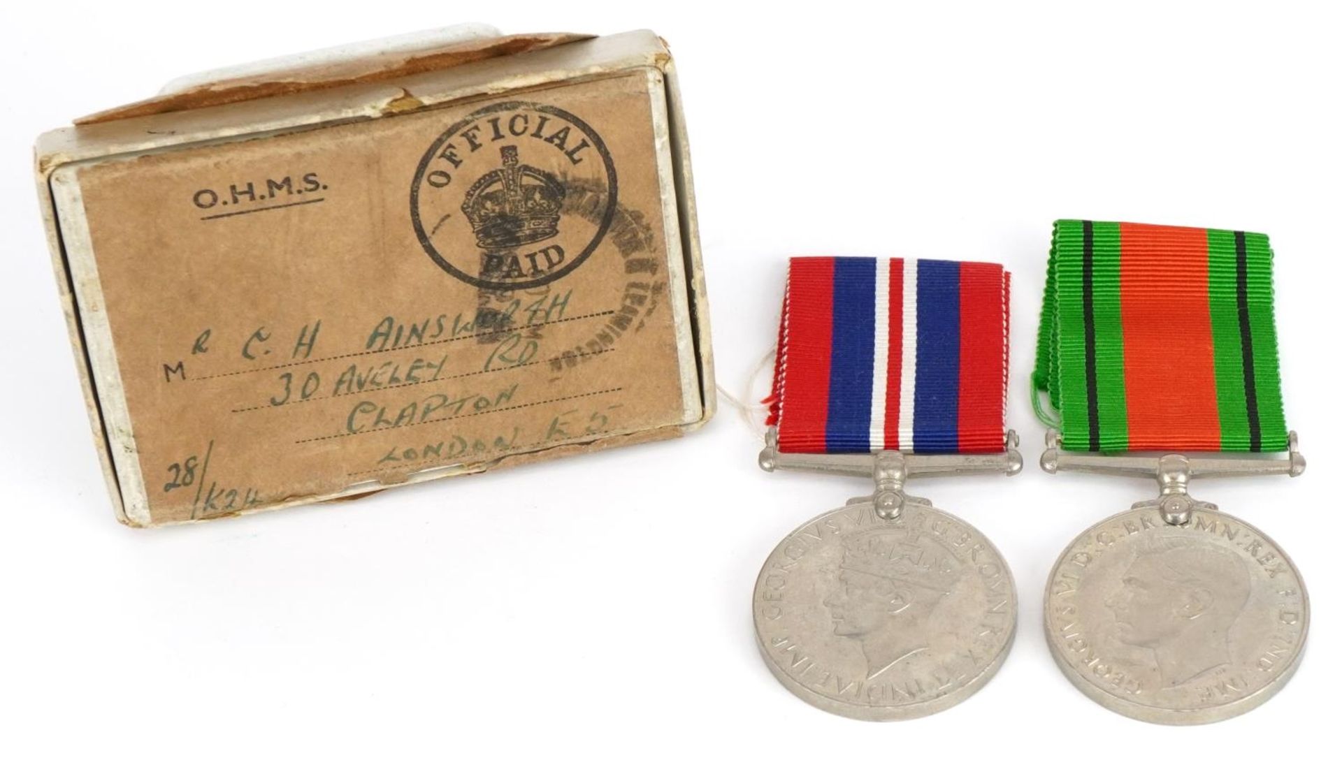 Two British military World War II medals with box of issue inscribed R C H Ainsworth : For further