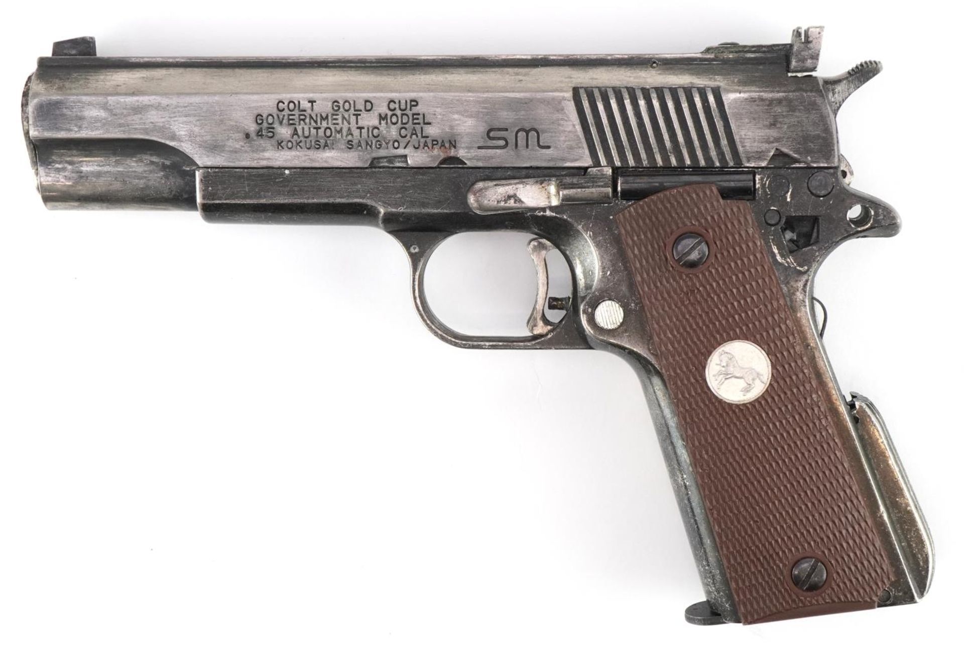 Decorative model of a Colt Gold Cup government model .45 automatic cal pistol by Kokusai Japan, 21.