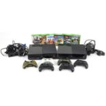 Two Microsoft Xbox 1 games consoles with various controllers and games including Worms and Minecraft