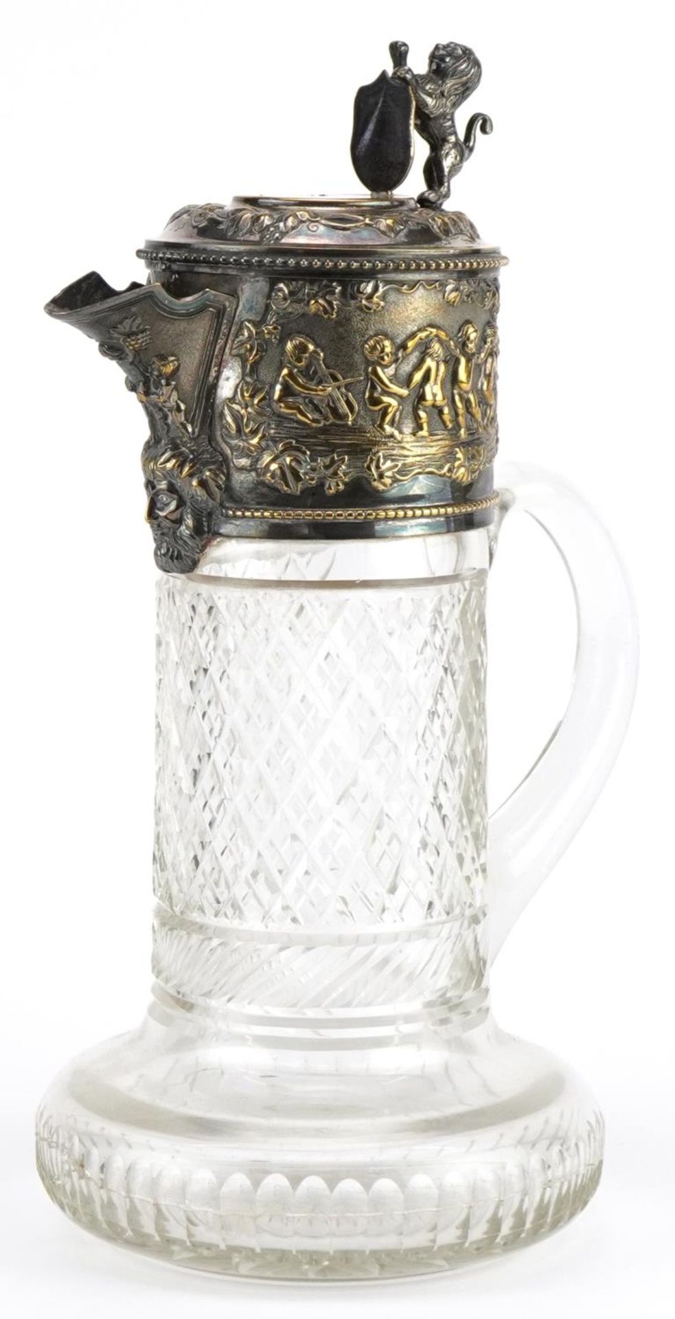 19th century cut glass claret jug with silver plated mounts embossed with a Bacchanalian scene