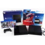 Two Sony PlayStation 4 consoles with boxes and three games comprising UFC 3, Destiny 2 and Harry