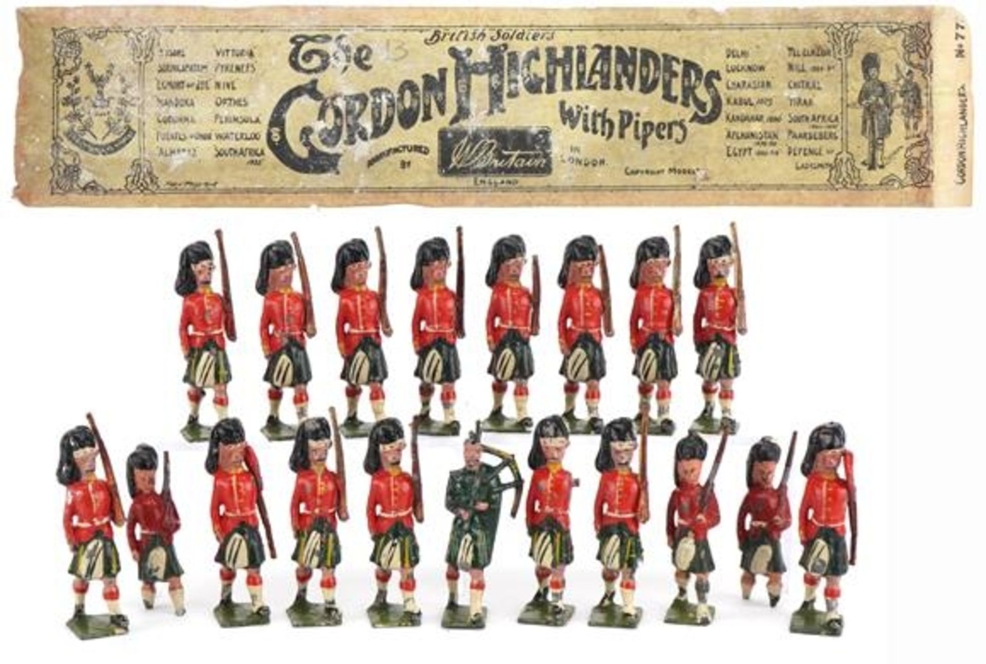 Nineteen Britains hand painted lead Gordon Highlanders soldiers and piper, some with articulated
