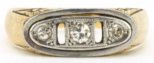 Art Deco unmarked gold diamond three stone ring with engraved shoulders, tests as 18ct gold, size P,