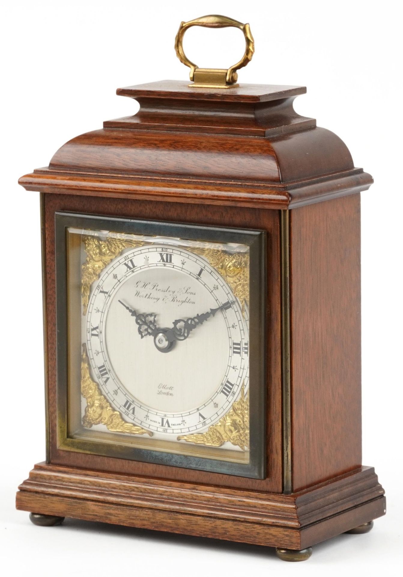 Mahogany cased Elliott bracket type mantle clock with silvered dial and circular chapter ring having