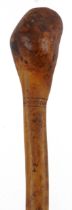 Australian Aboriginal nulla nulla throwing club decorated with a serpent and sea creatures, 56.5cm