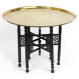 Islamic brass tray top tea table profusely engraved with panels of calligraphy on Moorish style