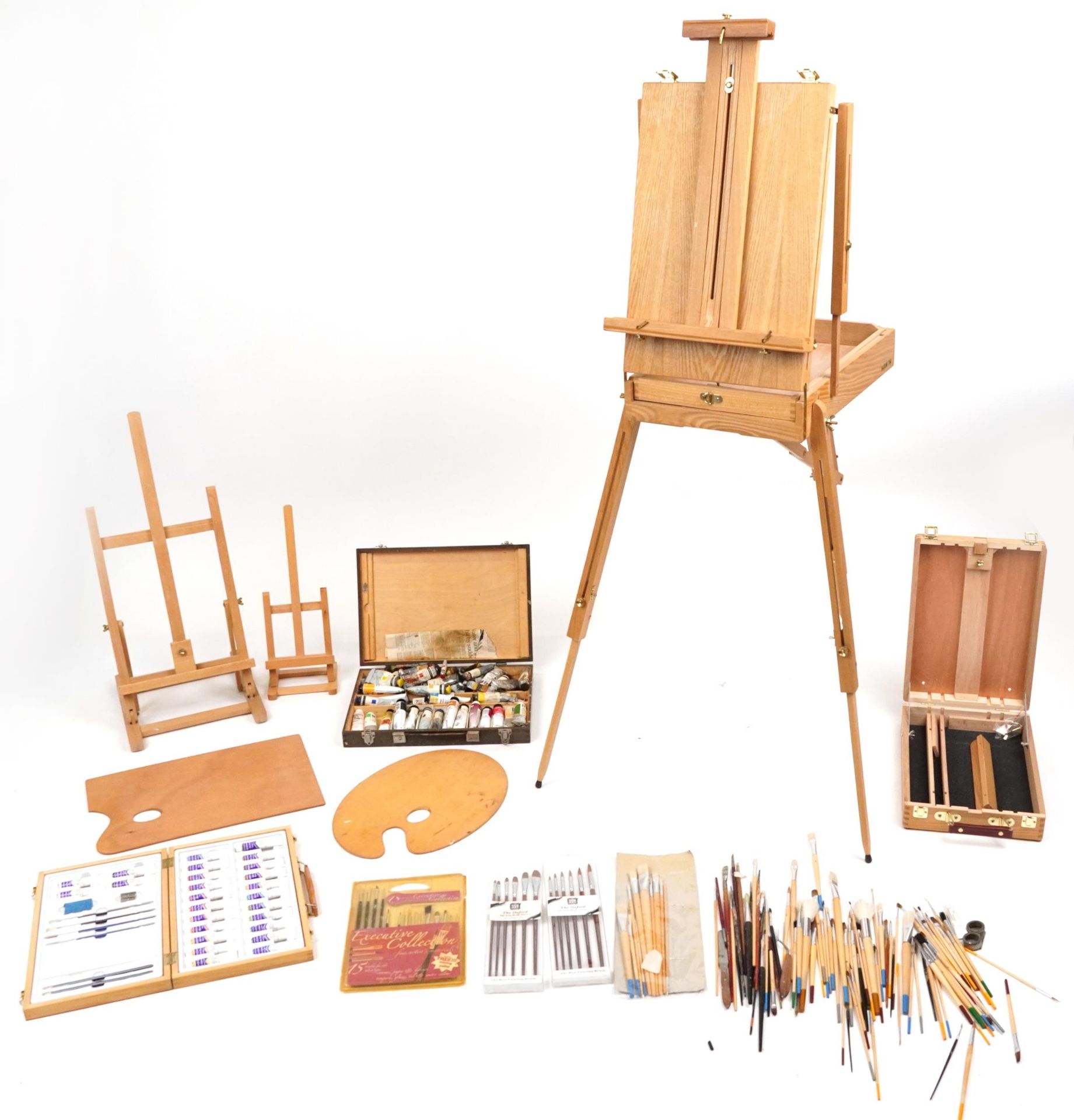 Good collection of artist's equipment including travelling easels, paint brushes, palettes and