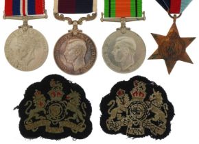 British military World War II RAF four medal group with two cloth badges including Long Service &