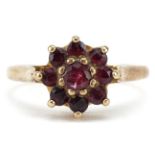 9ct gold garnet flower head ring, size N, 2.6g : For further information on this lot please visit