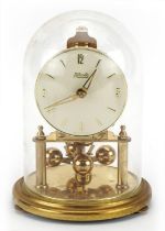 Kundo brass anniversary clock under a glass dome, 18cm high : For further information on this lot