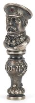 Silver desk seal in the form of a Russian officer in uniform set with a cabochon ruby and clear