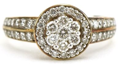 9ct gold diamond flower head cluster ring with diamond set shoulders, total diamond weight