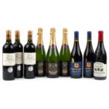 Six bottles of red wine and three bottles of Blanc de Noirs Champagne, the red wine comprising three