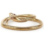 9ct gold serpent bangle with ruby eyes, 7cm in diameter, 31.2g : For further information on this lot