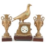 19th century continental gilt metal grouse design mantle clock with garniture vases, each raised