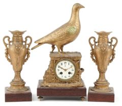 19th century continental gilt metal grouse design mantle clock with garniture vases, each raised