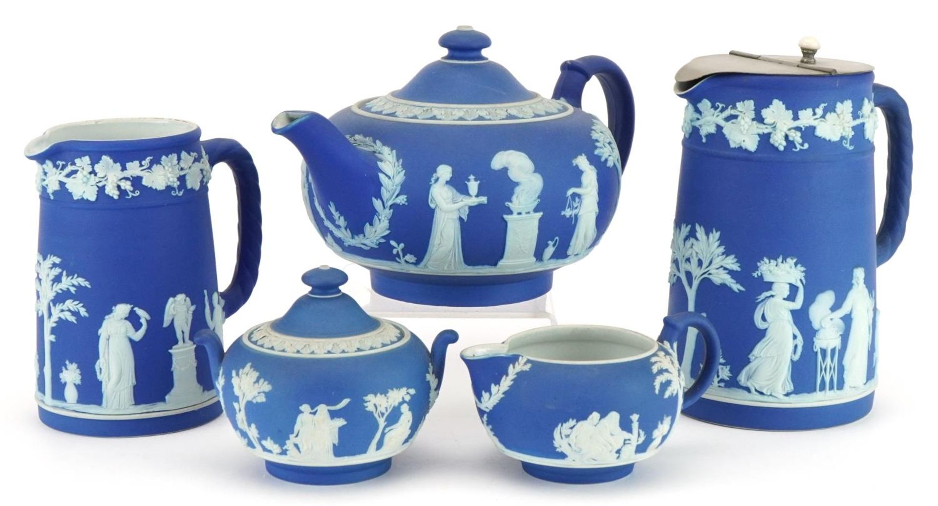 Wedgwood blue and white Jasperware decorated with classical Grecian females and Putti including
