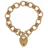 9ct gold chain link bracelet with 9ct gold love heart padlock, 18cm in length, 29.7g : For further