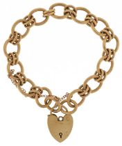 9ct gold chain link bracelet with 9ct gold love heart padlock, 18cm in length, 29.7g : For further