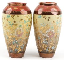 Royal Doulton, Pair of Doulton Lambeth Slater's Patent vases hand painted with stylised flowers,