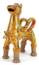 Turkish Canakkale pottery ewer having a yellow and green glaze, in the form of a lion, 20cm high :