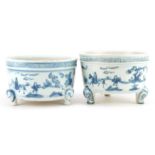 Two Chinese blue and white porcelain tripod censers decorated with figures in landscapes, each