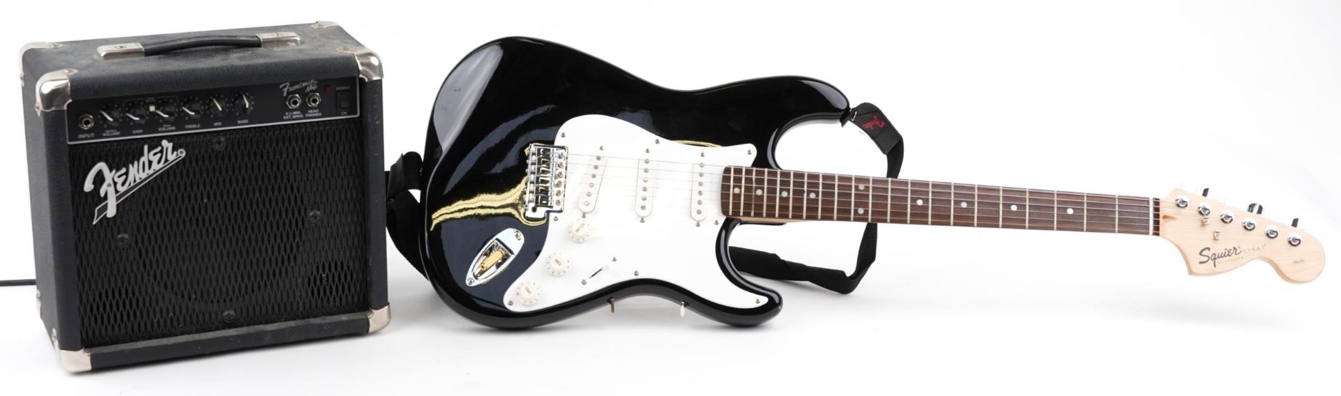 Squire Strat by Fender six string electric guitar with Fender Front Man amp and protective travel