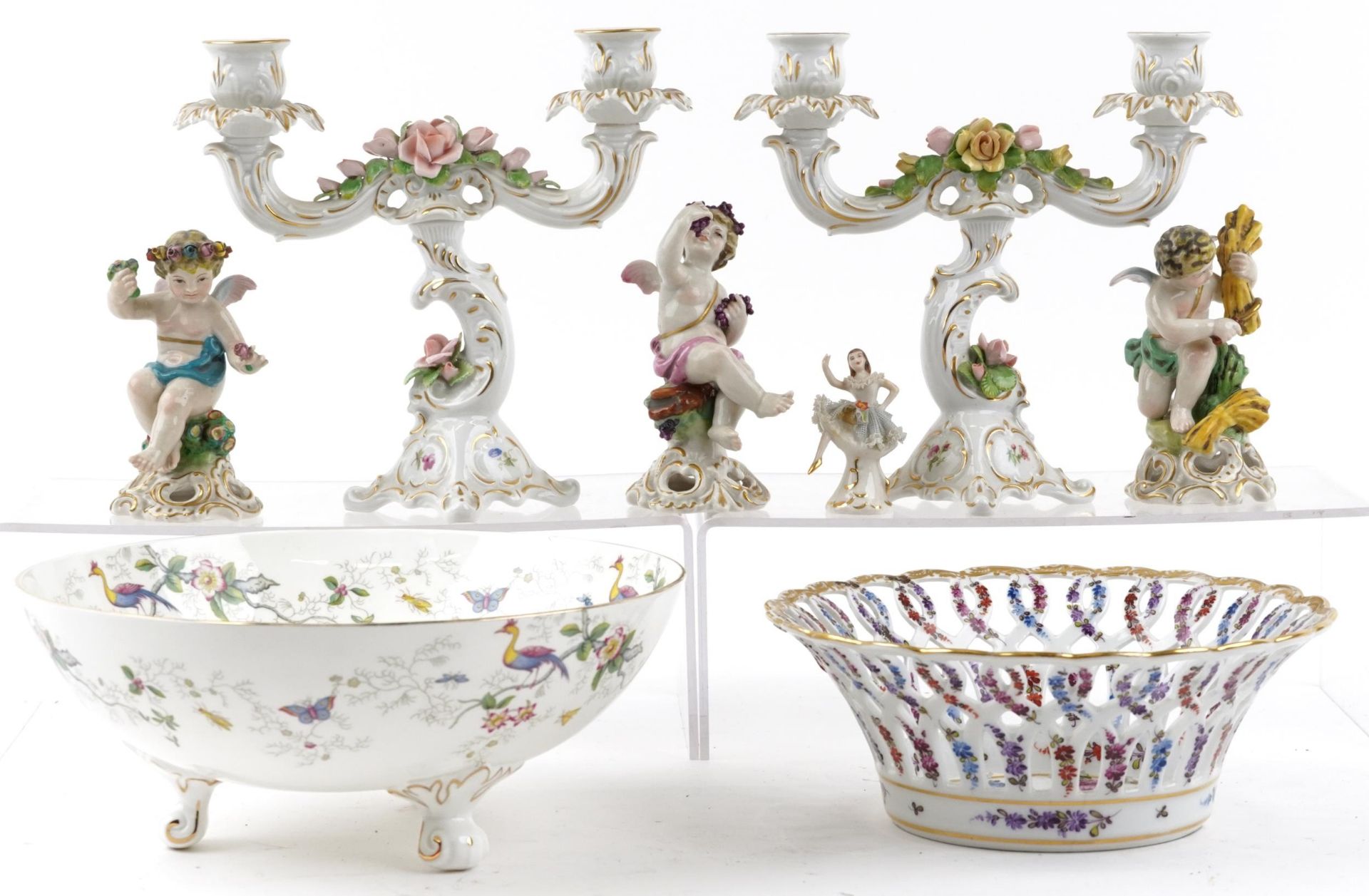 Continental and English porcelain including Dresden Lace figurine, three figures of Putti, Meissen