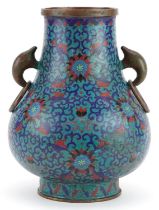 Chinese cloisonne vase with ring turned handles enamelled with flower heads amongst scrolling