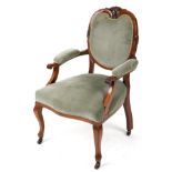 Victorian style armchair with olive green upholstery on cabriole legs with casters, 95cm high :