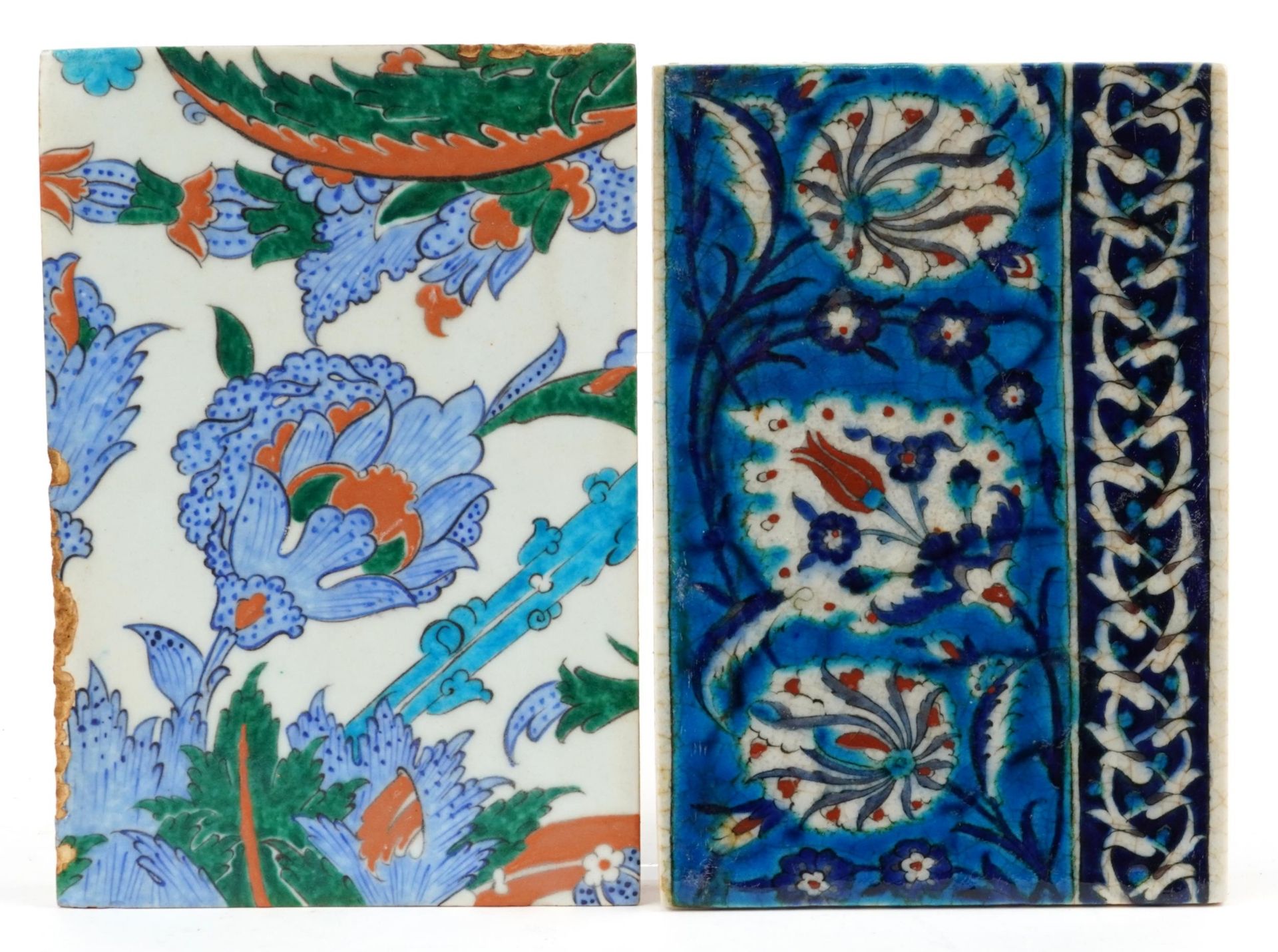 Two Turkish Ottoman Iznik pottery tiles hand painted with flowers, the largest 24cm x 17cm : For