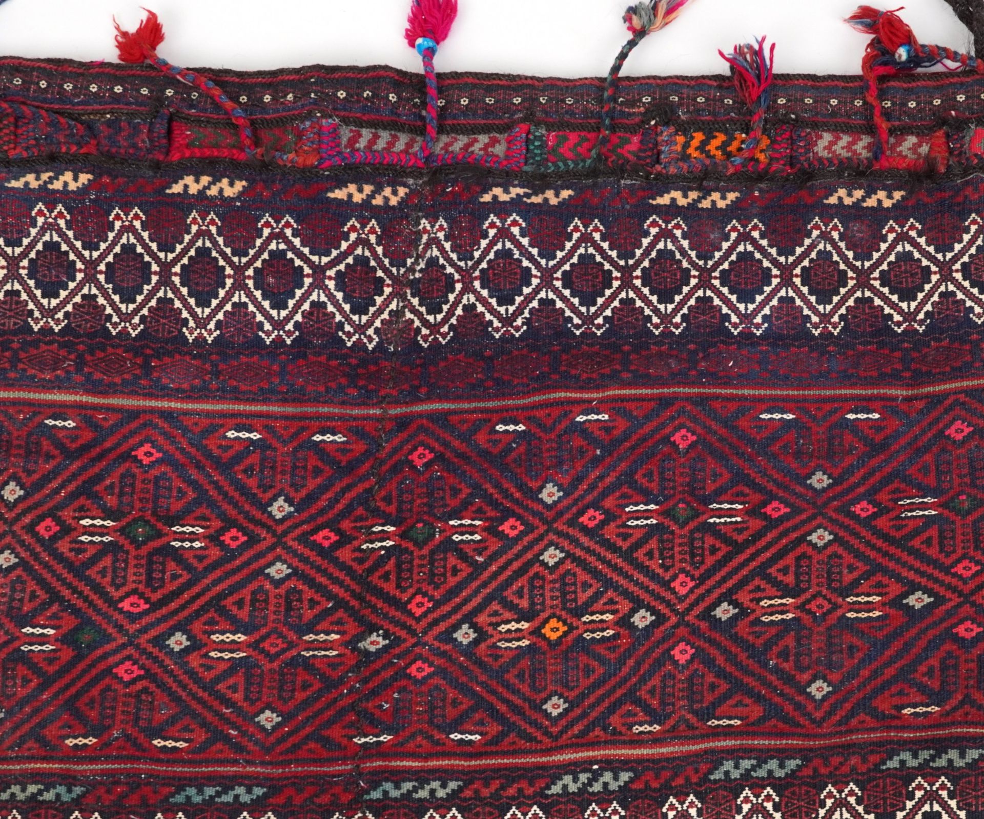 Rectangular Afghan red ground saddle bag having an allover repeat design, 150cm x 80cm : For further - Image 3 of 7
