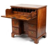 Antique figured walnut cross and feather banded kneehole secretaire desk fitted with an