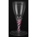 18th century cordial glass with multiple red and white opaque twist stem, 11.5cm high : For