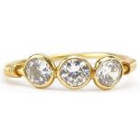 Yellow metal clear stone three stone ring, size K, 1.1g : For further information on this lot please