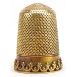Unmarked gold thimble, tests as 15ct gold, 2.3cm high, 6.2g : For further information on this lot