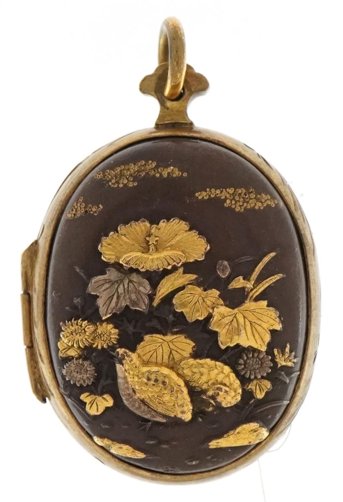 Good Japanese Shakudo mixed metal locket decorated in relief with two quails amongst flowers and a