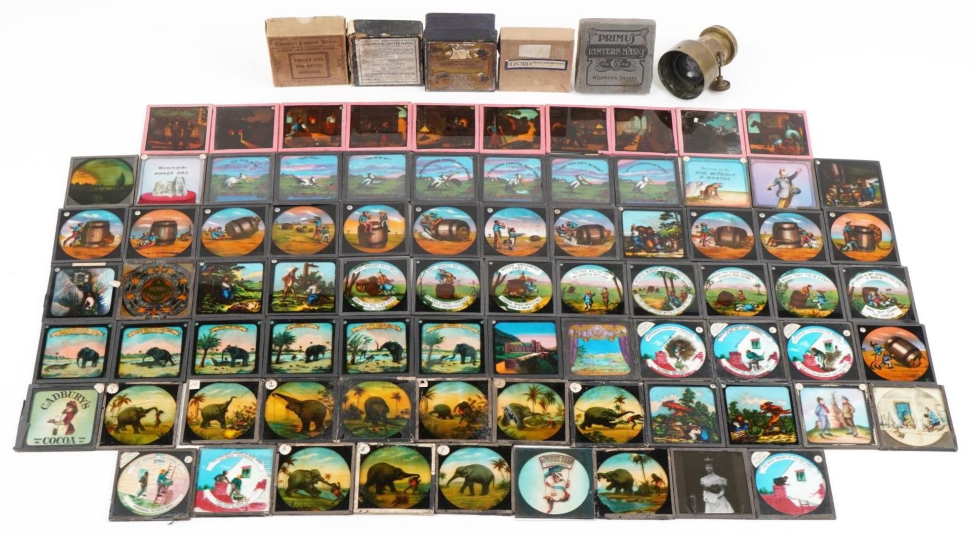 Collection of Victorian magic lantern glass slides and a lens, the slides including Cadburys and