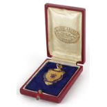 Sporting interest 9ct rose gold and enamel Liverpool and district C of E Sports League jewel