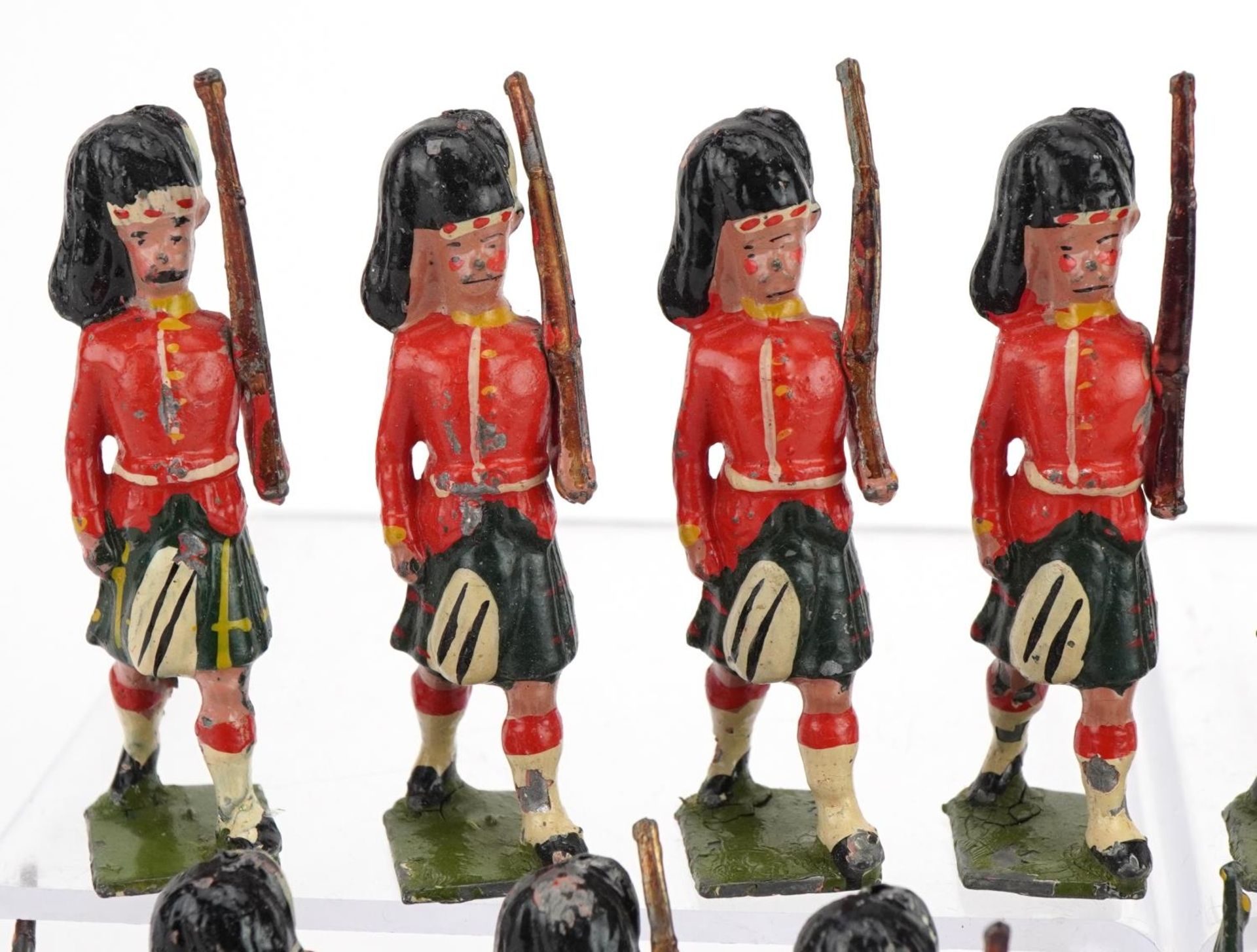 Nineteen Britains hand painted lead Gordon Highlanders soldiers and piper, some with articulated - Image 3 of 8