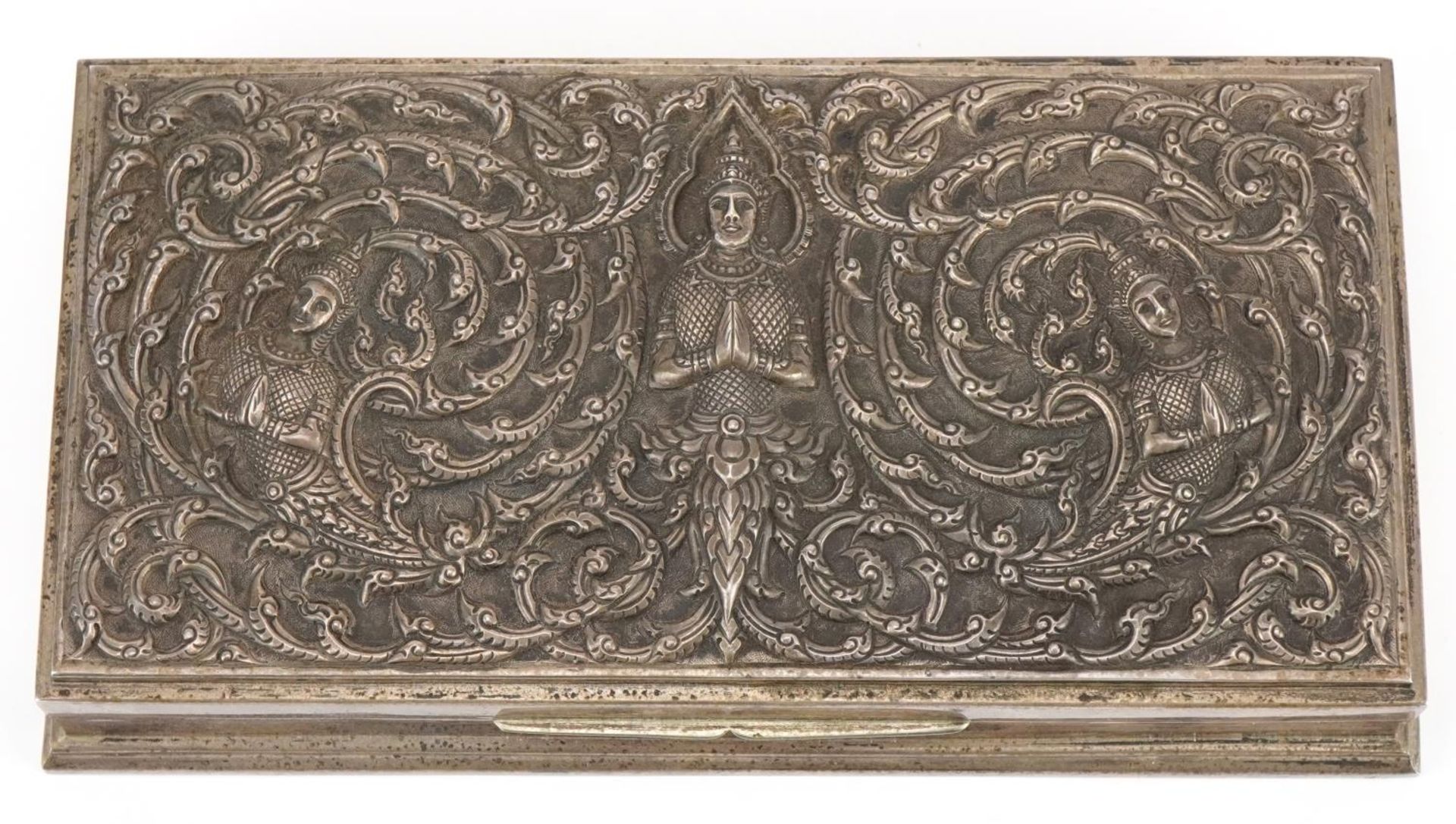 Thai Siam sterling silver cigar box having hinged lid profusely embossed with deities, 3.5cm H x - Image 2 of 6