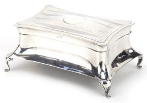 Henry Williamson Ltd, Arts & Crafts silver four footed jewel box with hinged lid, Birmingham 1919,