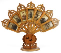 19th century Italian inlaid Sorento ware olive wood seven section adjustable photo frame in the form